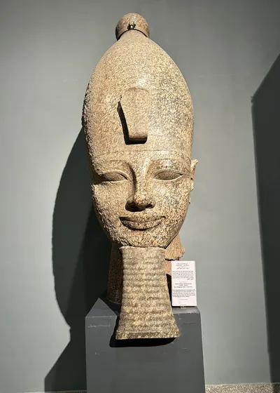 Luxor, Egypt - Feb 9, 2025: Head of a colossal statue of Pharaoh Amenhotep III from ancient Egypt, displayed at the Luxor Museum.