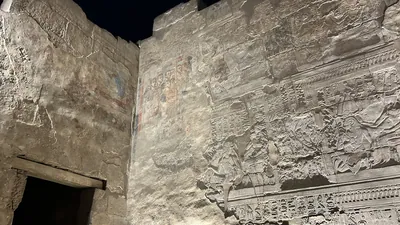 Luxor, Egypt - Feb 9, 2025: Coptic Christian wall painting plastered over ancient Egyptian reliefs, showing layered history of Luxor Temple in Egypt.