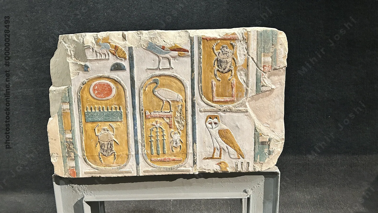 Luxor, Egypt - Feb 9, 2025: Ancient limestone block with three cartouches of Pharaohs Thutmosis I and Thutmosis III, displayed in Luxor Museum.