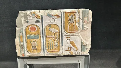 Luxor, Egypt - Feb 9, 2025: Ancient limestone block with three cartouches of Pharaohs Thutmosis I and Thutmosis III, displayed in Luxor Museum.