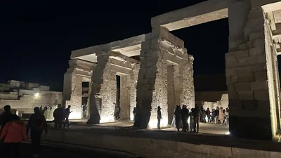 Kom Ombo, Egypt - Feb 8, 2025: Night view of the Temple of Kom Ombo, with illuminated columns and reliefs as visitors explore the ancient site.