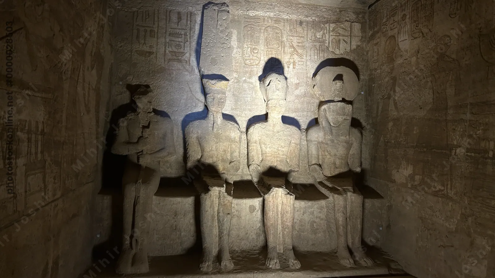 Aswan, Egypt - Feb 8, 2025: Sanctuary of the Great Temple of Abu Simbel with seated statues of Ptah, Amun-Ra, Ramesses II, and Ra-Horakhty carved into