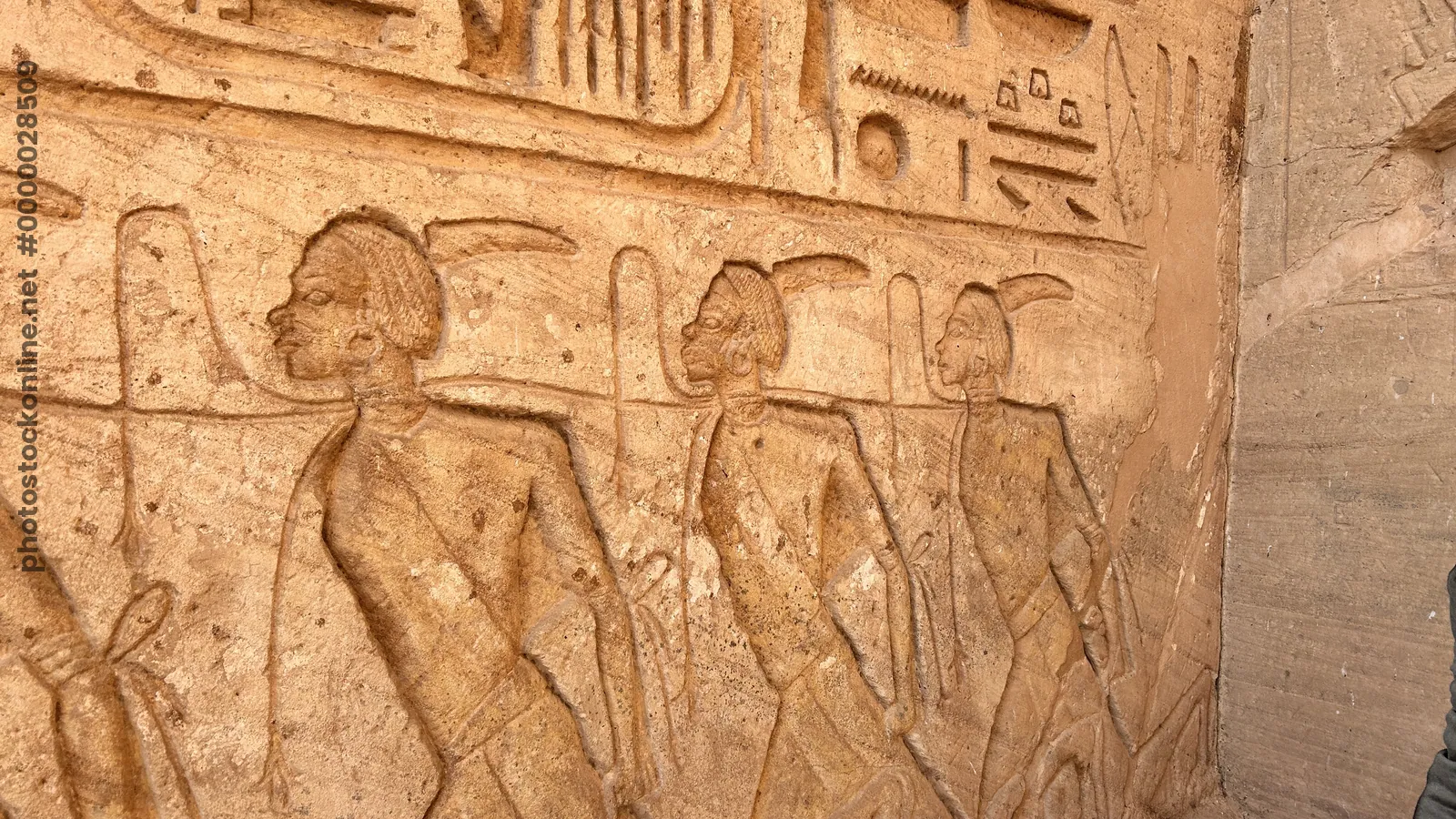 Aswan, Egypt - Feb 8, 2025: Ancient relief at Abu Simbel showing bound captives symbolizing defeated enemies during the reign of Pharaoh Ramesses II.