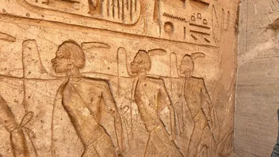 Aswan, Egypt - Feb 8, 2025: Ancient relief at Abu Simbel showing bound captives symbolizing defeated enemies during the reign of Pharaoh Ramesses II.