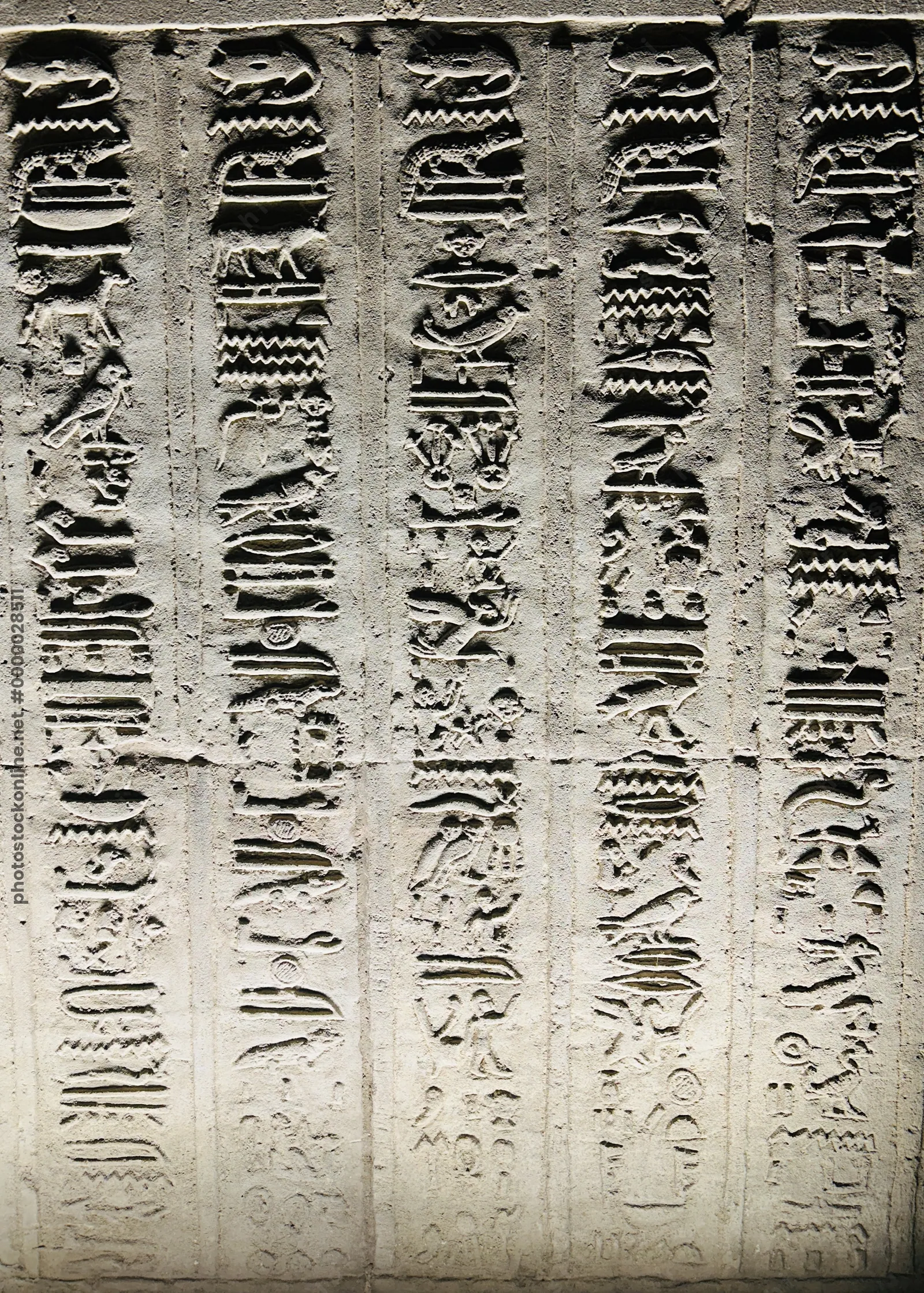 Kom Ombo, Egypt - Feb 8, 2025: Ancient hieroglyphic inscriptions carved on the sandstone walls of Kom Ombo temple in Egypt.