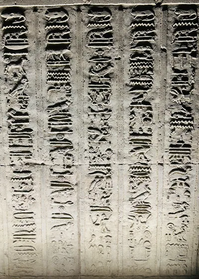 Kom Ombo, Egypt - Feb 8, 2025: Ancient hieroglyphic inscriptions carved on the sandstone walls of Kom Ombo temple in Egypt.