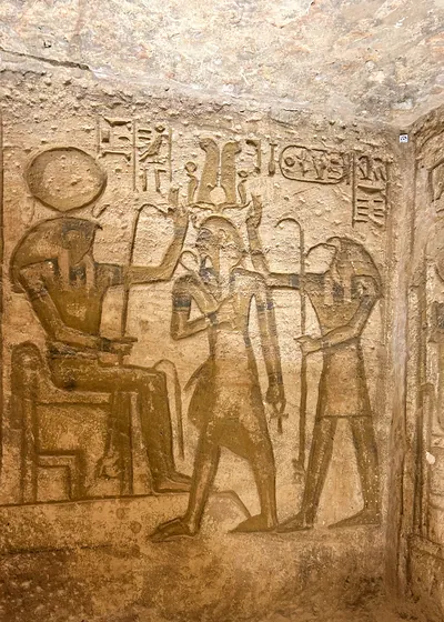 Aswan, Egypt - Feb 8, 2025: Ancient wall relief at Abu Simbel showing Pharaoh with Egyptian deities and hieroglyphs.
