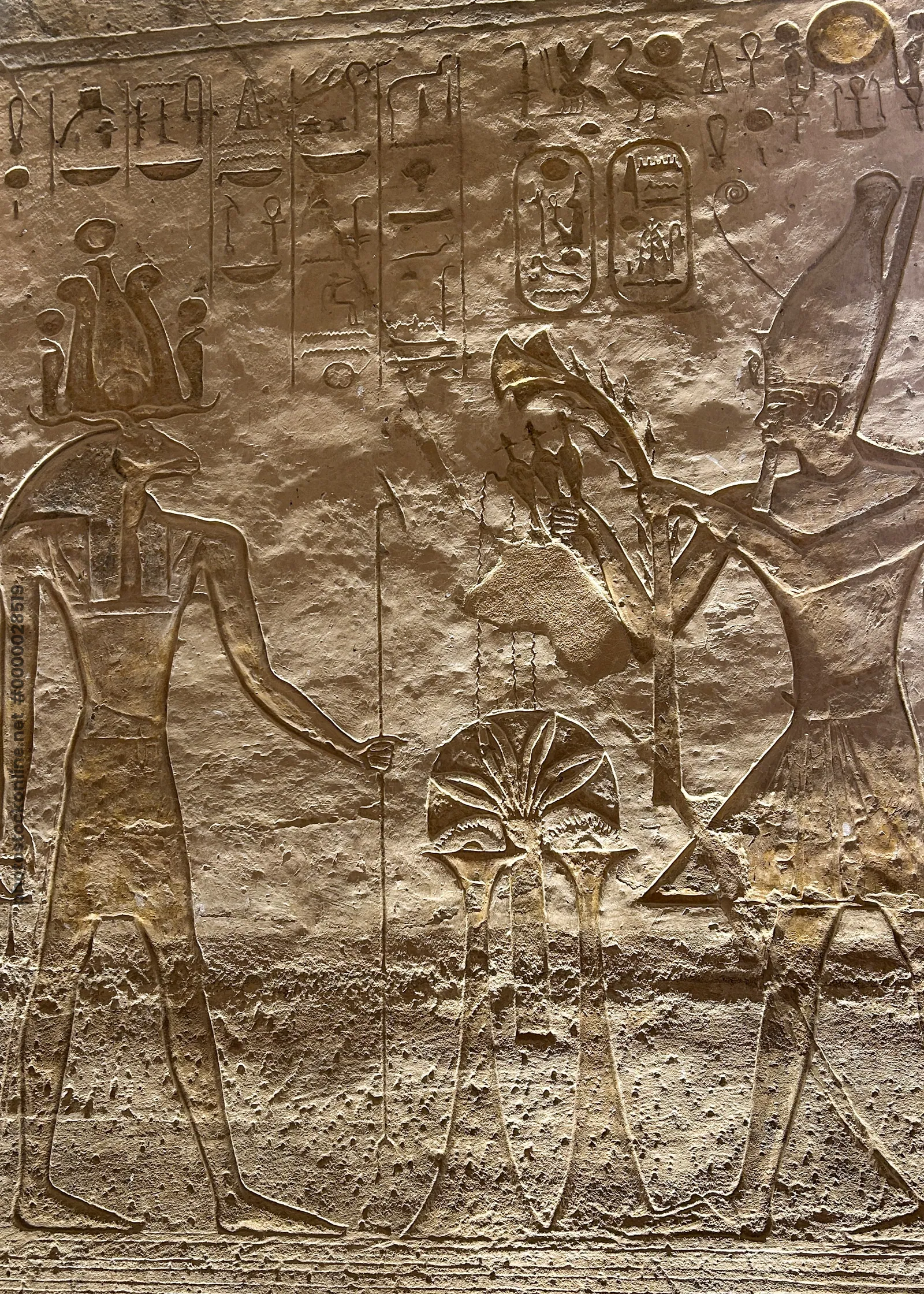 Ancient relief depicting the Egyptian god Khnum carved on the walls of the Abu Simbel temple