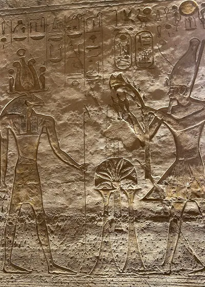 Ancient relief depicting the Egyptian god Khnum carved on the walls of the Abu Simbel temple
