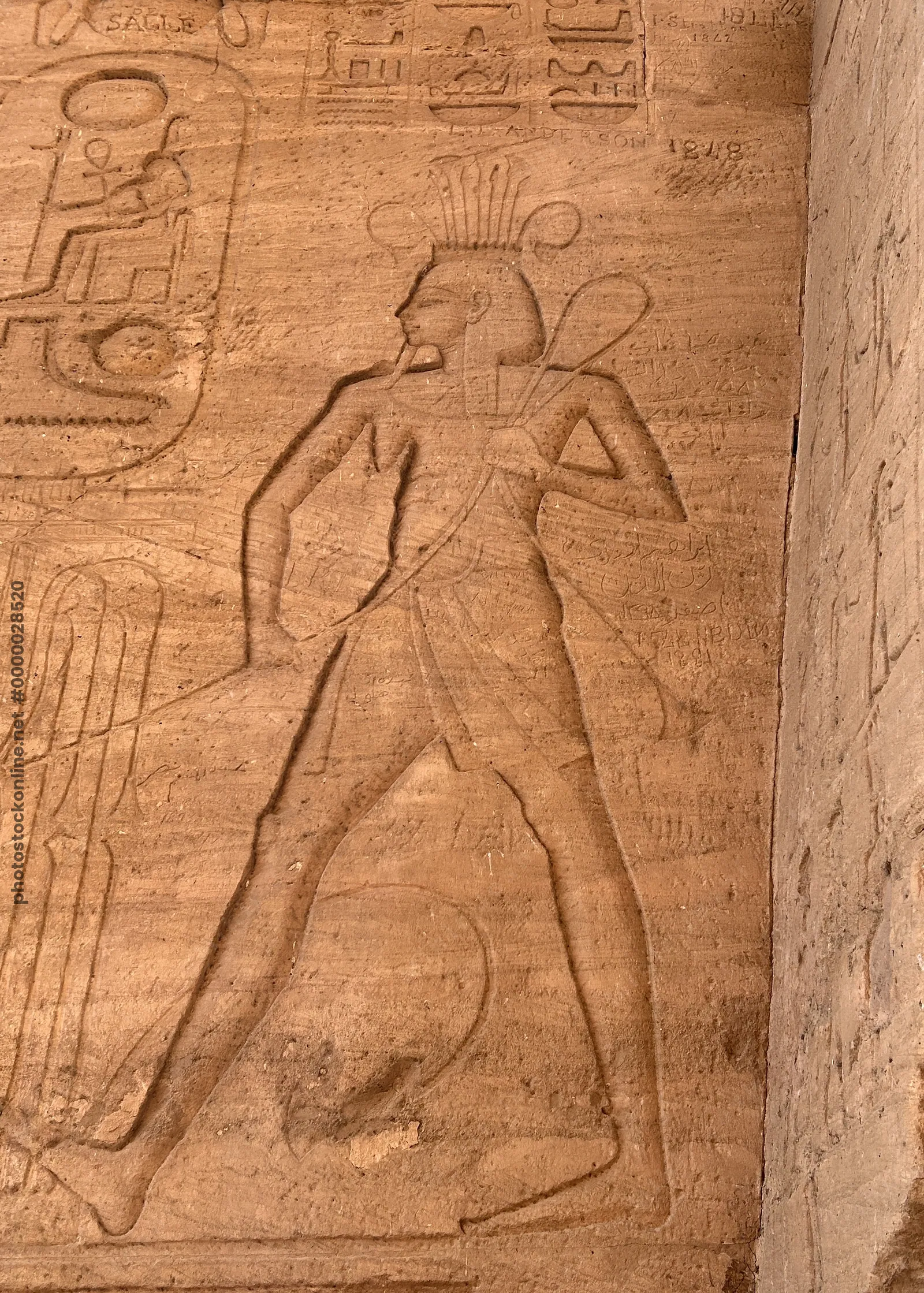 Carved relief of the god Amun, inside the Temple of Ramesses II at Abu Simbel, Egypt.