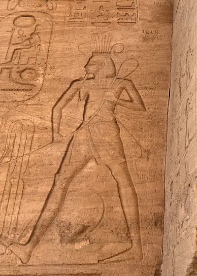 Carved relief of the god Amun, inside the Temple of Ramesses II at Abu Simbel, Egypt.