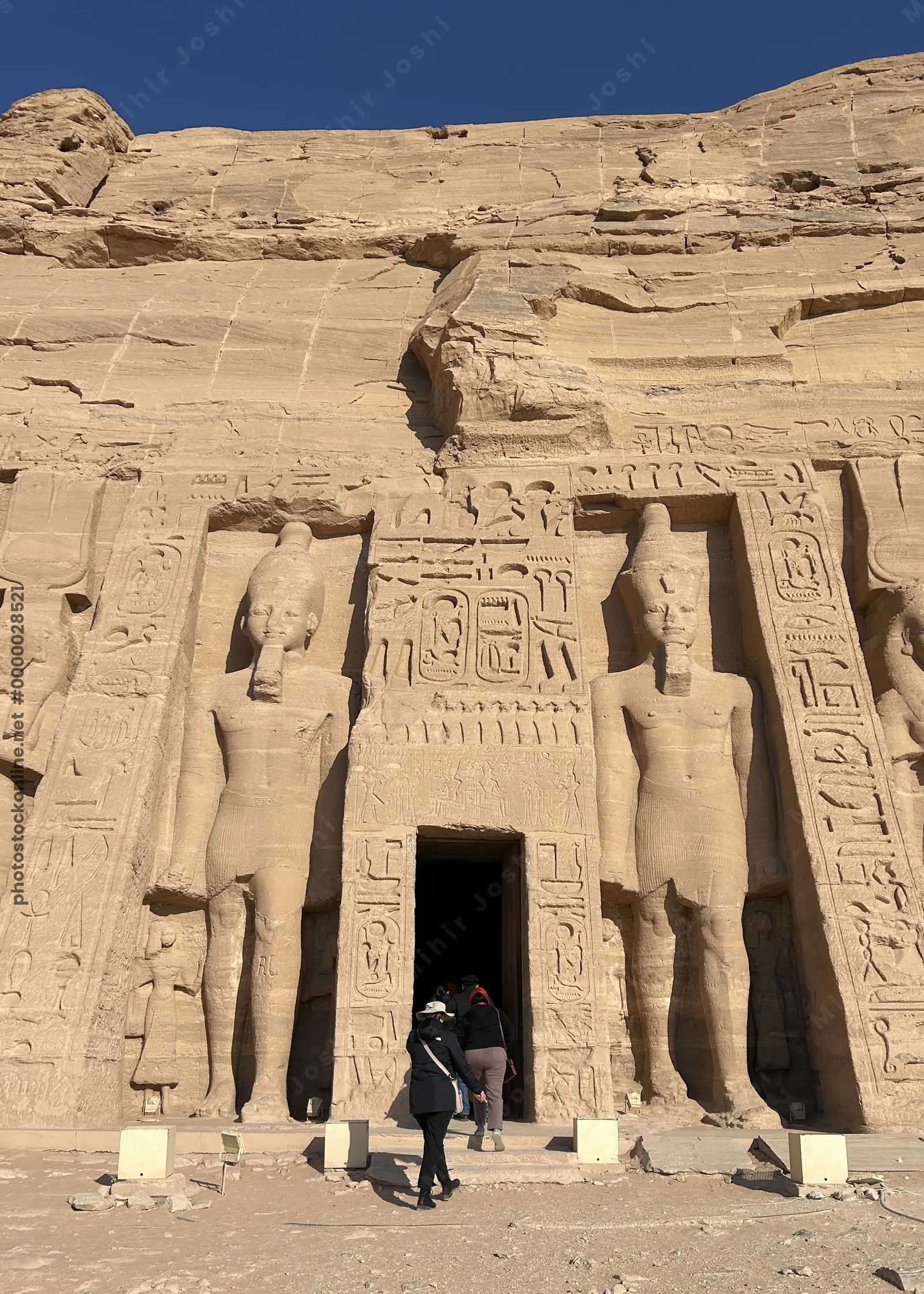 Temple at Abu Simbel dedicated to Queen Nefertari and Hathor, with rock-cut statues and intricate carvings on the facade
