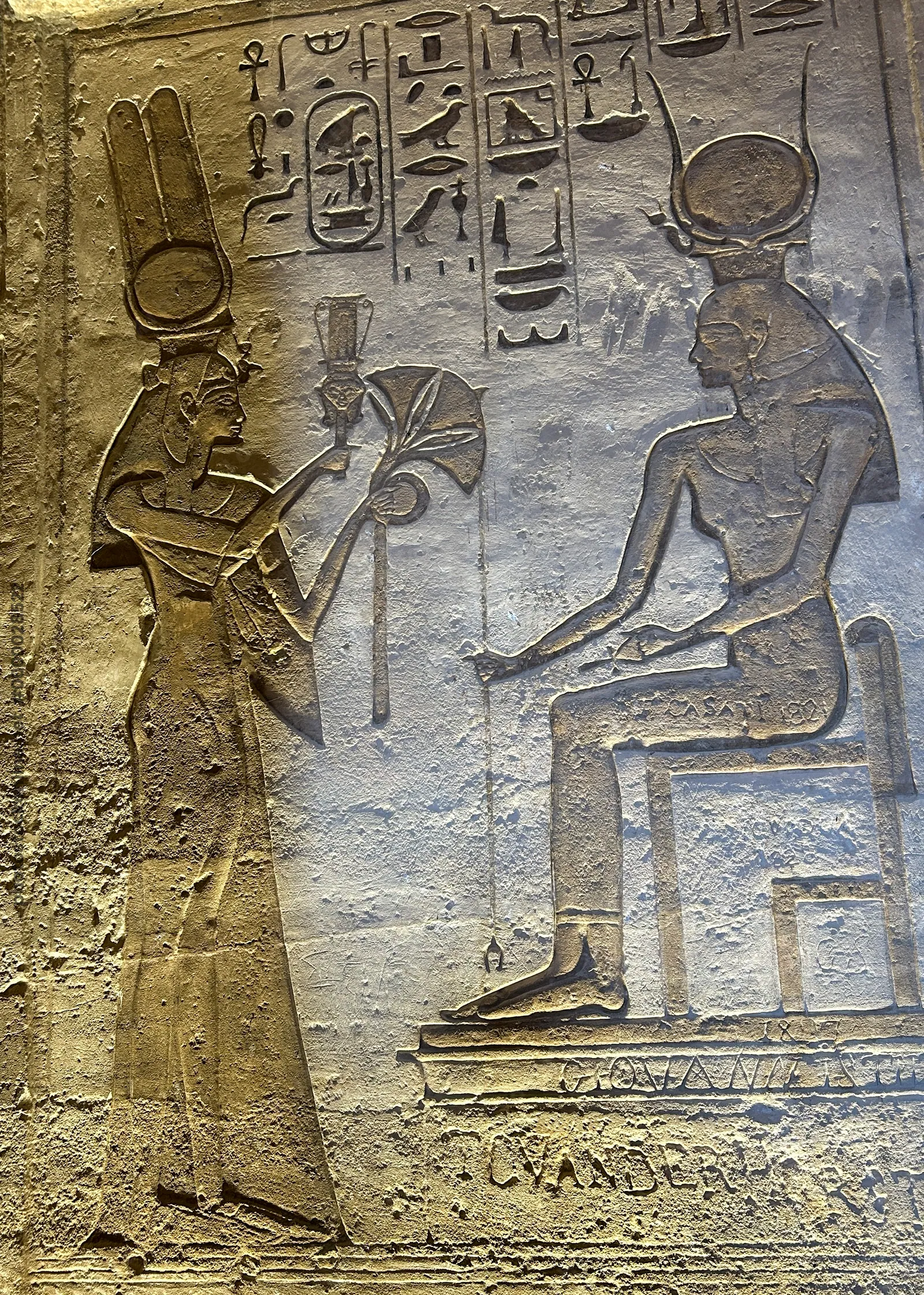 Ancient Egyptian wall relief showing Queen Nefertari and Goddess Hathor at Abu Simbel, Egypt.