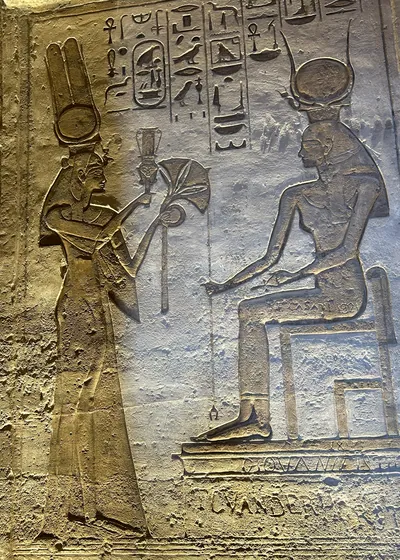 Ancient Egyptian wall relief showing Queen Nefertari and Goddess Hathor at Abu Simbel, Egypt.