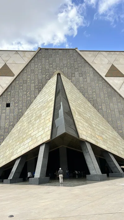 Exterior view of the Grand Egyptian Museum near the Giza Pyramids