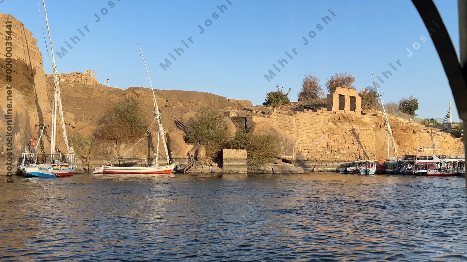 Boat ride to Temple of Isis, relocated from Philae to Agilkia Island, Aswan, Egypt, with scenic Nile River views.