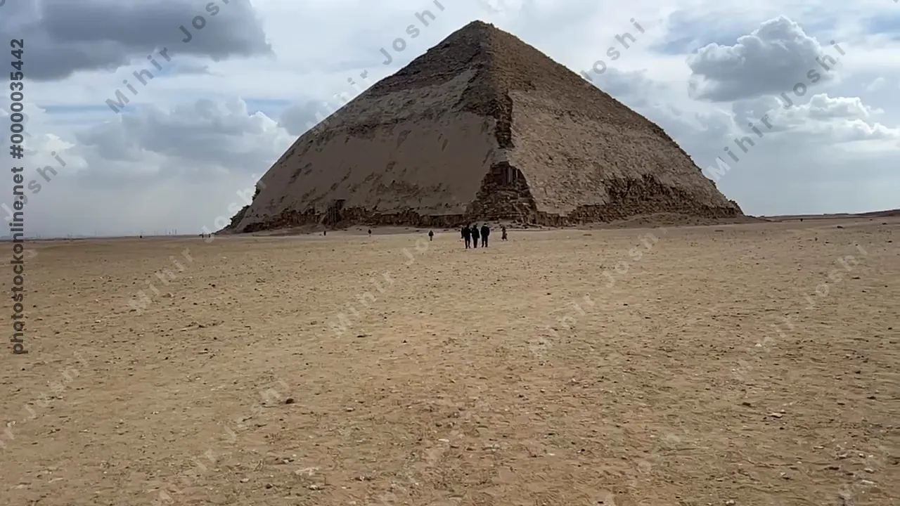 Dahshur, Egypt - Feb 5, 2024: The Bent Pyramid at Dahshur, built by Pharaoh Sneferu during the Old Kingdom, shows a unique change in angle midway up its structure.