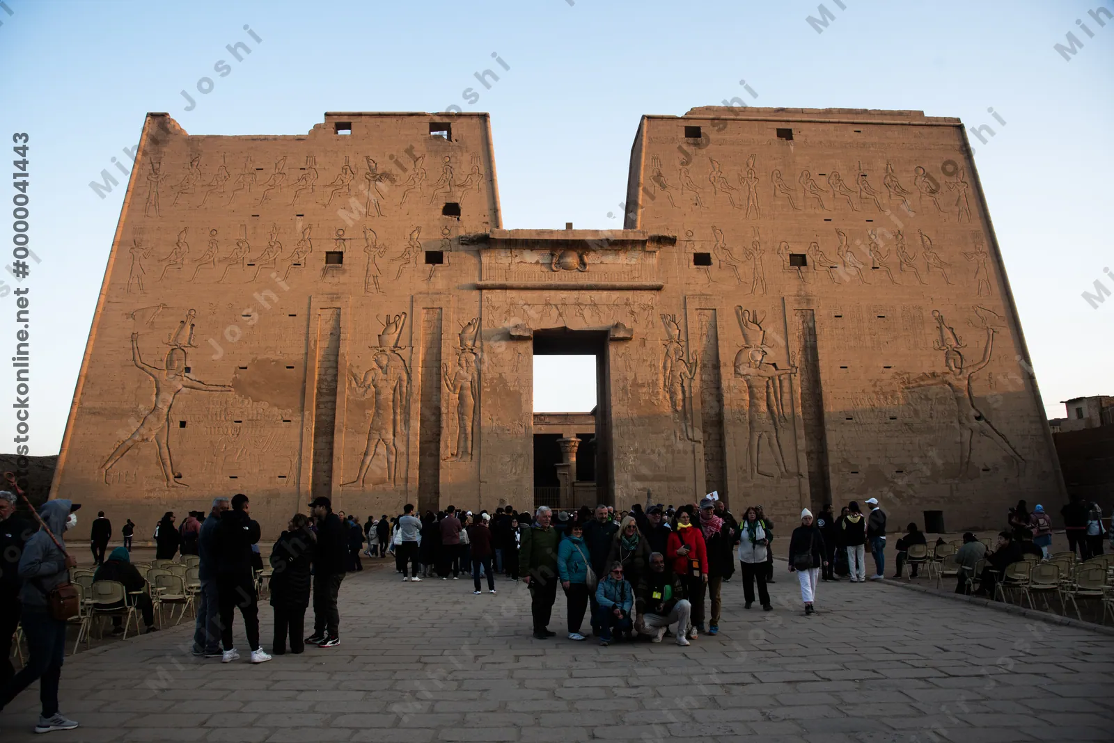 Tourists explore the Temple of Edfu at dawn, bath