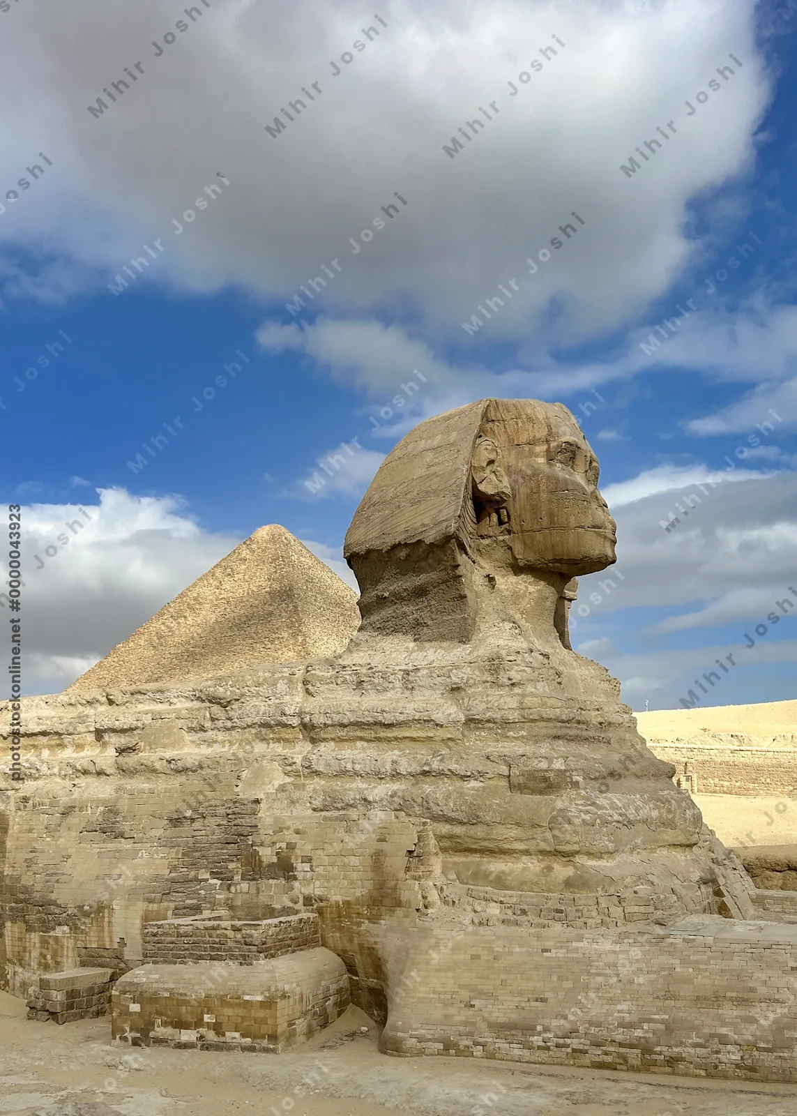 Giza, Egypt - Feb 6, 2025: The Great Sphinx of Giza with the iconic Great Pyramid in the background, a timeless view of ancient Egyptian grandeur.