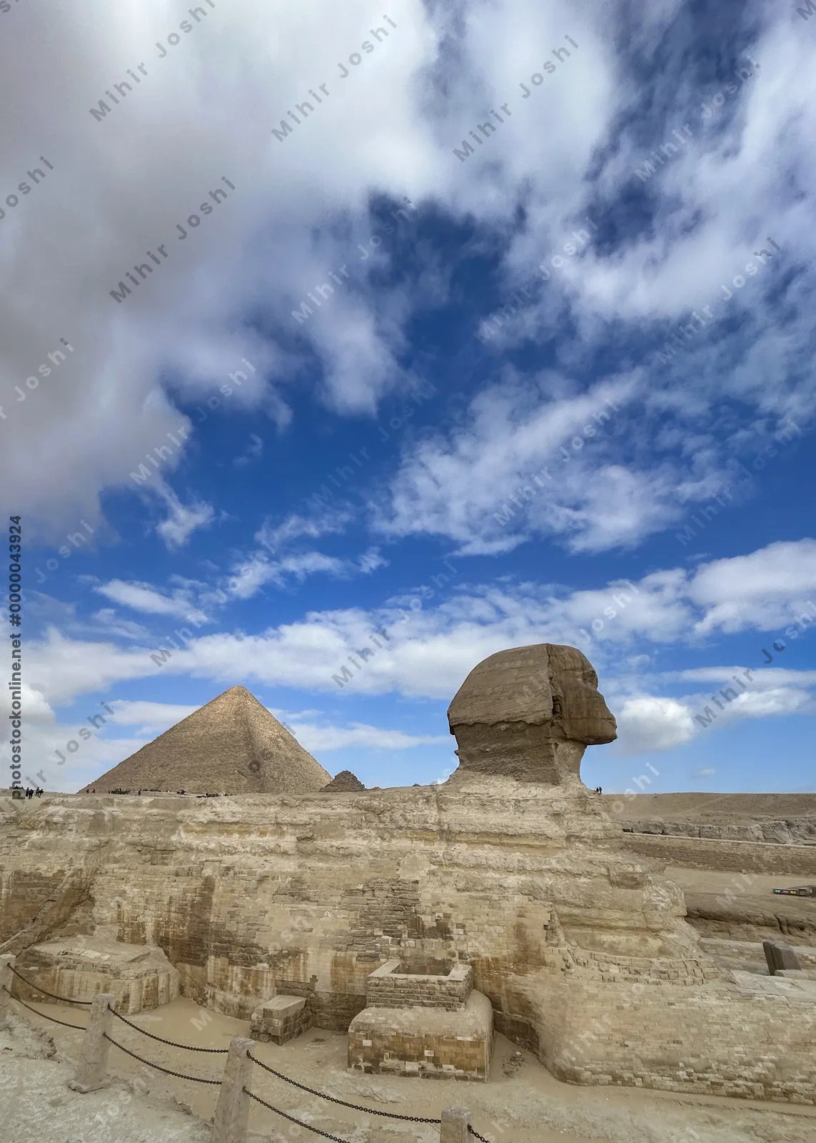 Giza, Egypt - Feb 6, 2025: The Great Sphinx of Giza with the iconic Great Pyramid in the background, a timeless view of ancient Egyptian grandeur.