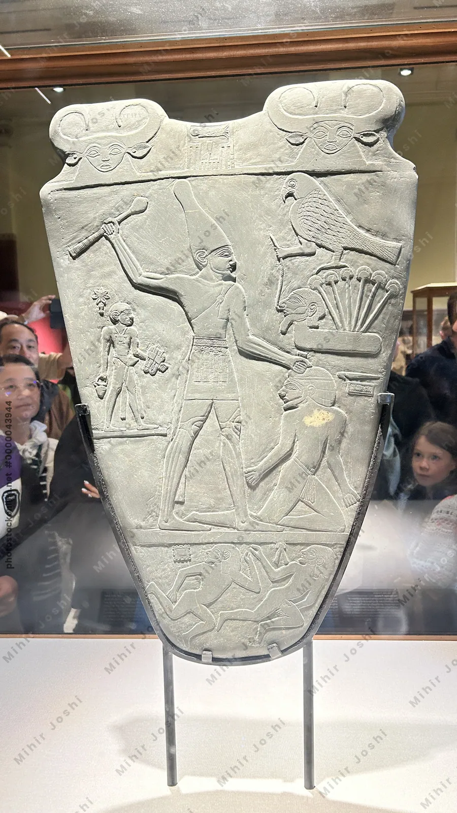 Cairo, Egypt -  Feb 4, 2025: The Narmer Palette, an iconic artifact from 31st century BC Egypt, symbolizing unification of Upper and Lower Egypt. On display in Cairo.