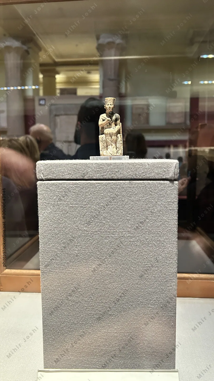 Cairo, Egypt -  Feb 4, 2025: Statuette of Khufu (Cheops), the only known three-dimensional representation of King Khufu, the builder of the Great Pyramid at Giza.