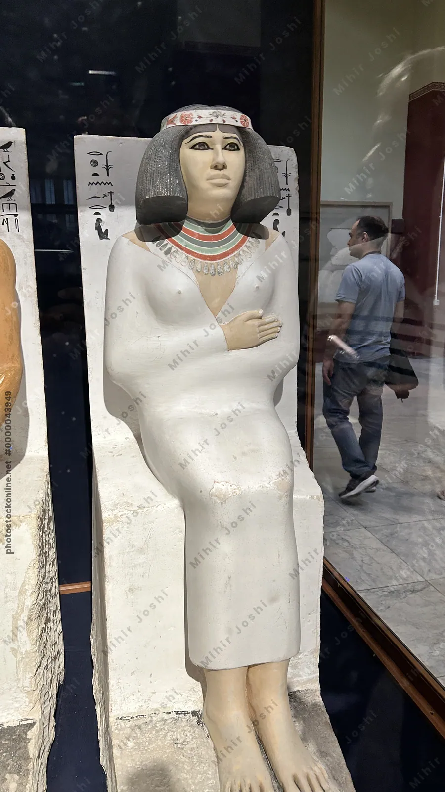 Cairo, Egypt -  Feb 4, 2025: Statue of Nofret, noblewoman of Ancient Egypt and wife of Prince Rahotep, displayed at the Egyptian Museum in Cairo.