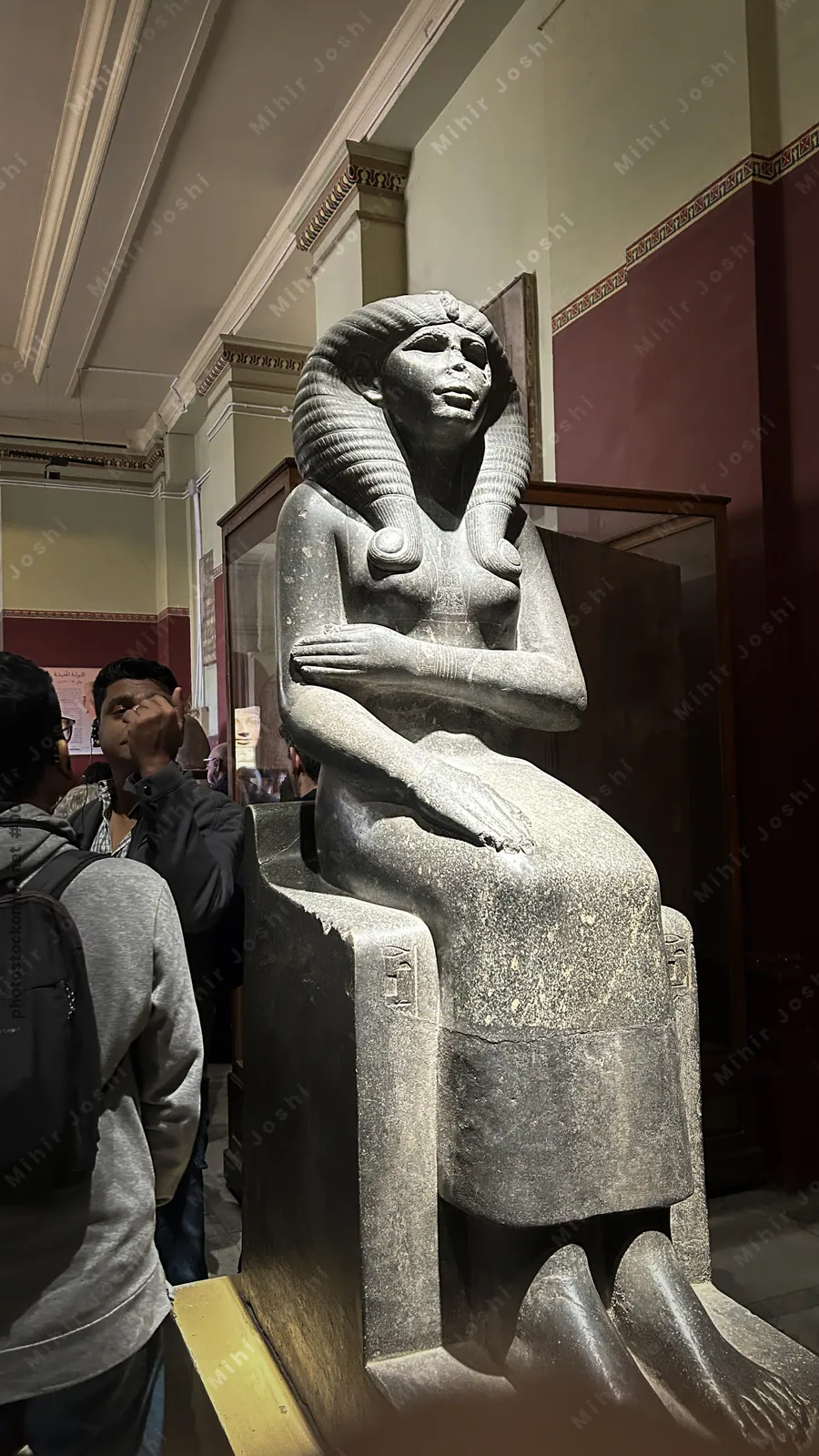 Cairo, Egypt -  Feb 4, 2025: Seated statue of Queen Nofret, 4th dynasty noblewoman, displayed at the Egyptian Museum in Cairo, Egypt.