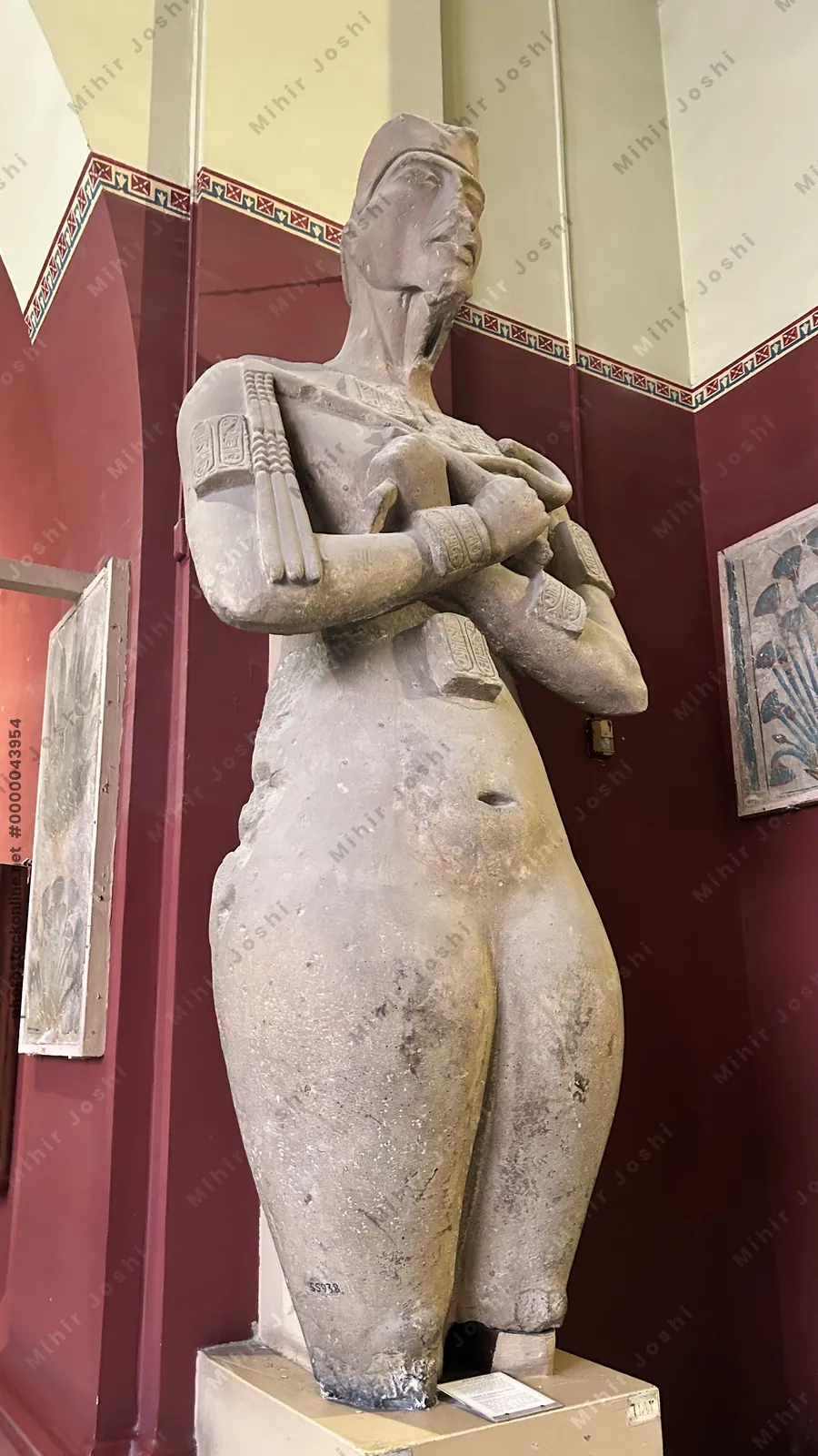 Cairo, Egypt -  Feb 4, 2025: Statue of Akhenaten, the revolutionary pharaoh who introduced Aten worship, at the Egyptian Museum in Cairo.