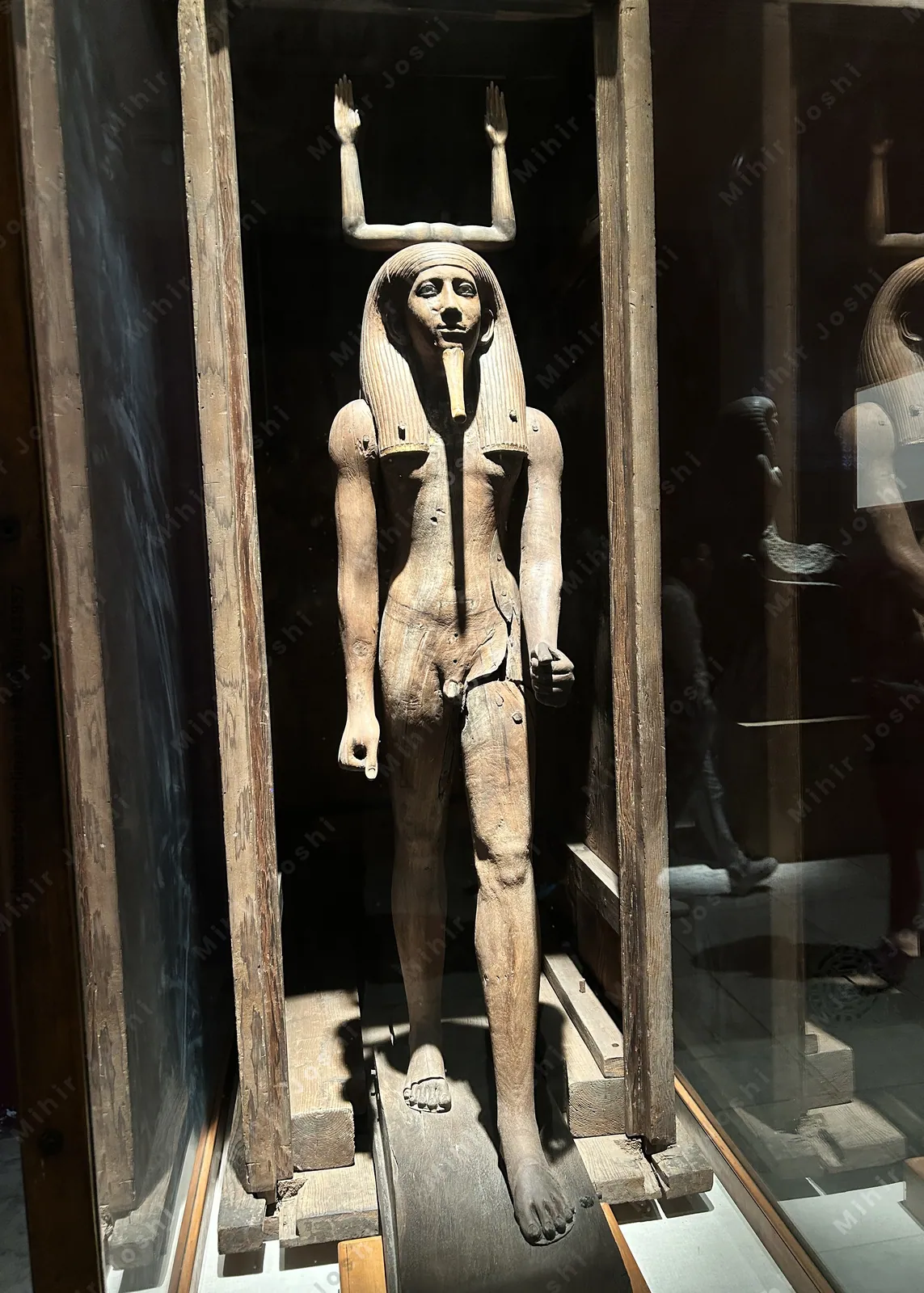 Cairo, Egypt -  Feb 4, 2025: Wooden Ka statue of King Hor with raised arms and Ka sign above head, symbolizing his spiritual essence. Egyptian Museum in Cairo.