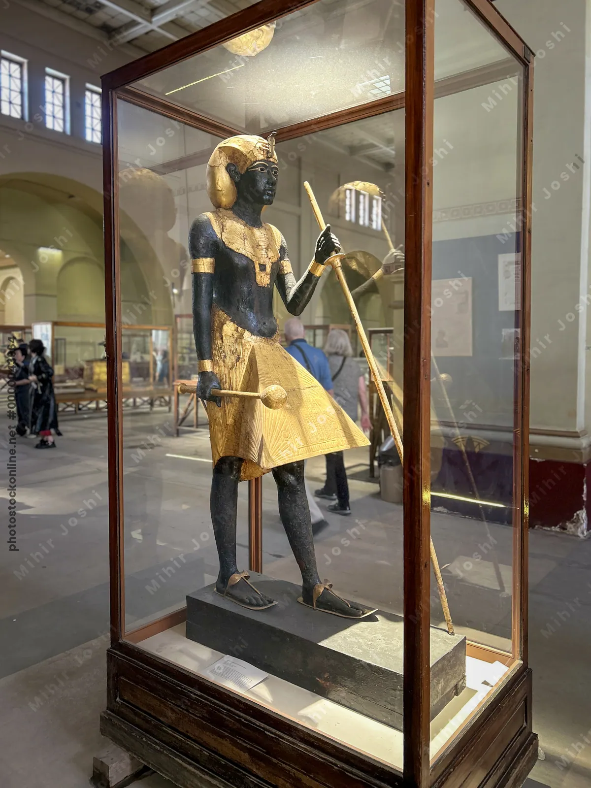 Cairo, Egypt -  Feb 4, 2025: Guardian statue of Pharaoh Tutankhamun wearing the khat headdress, discovered in his tomb, now displayed at the Egyptian Museum of Antiquities in Cairo.