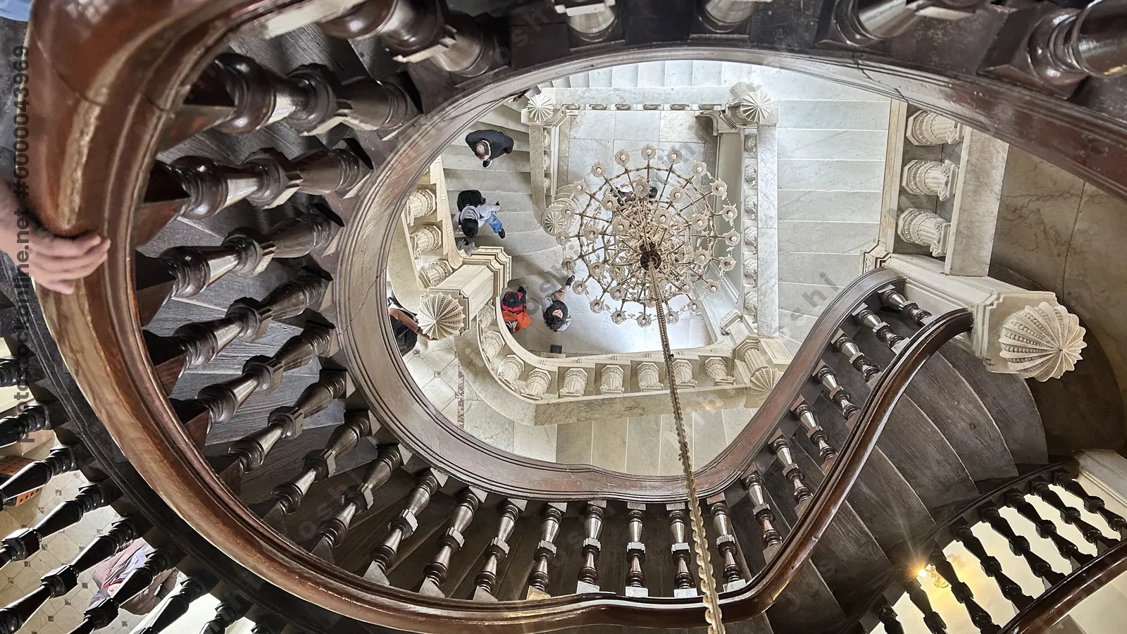 Heliopolis, Cairo, Egypt -  Feb 4, 2024: Ornate spiral staircase inside Baron Empain Palace, a Hindu-style architectural gem in Heliopolis, Cairo, Egypt