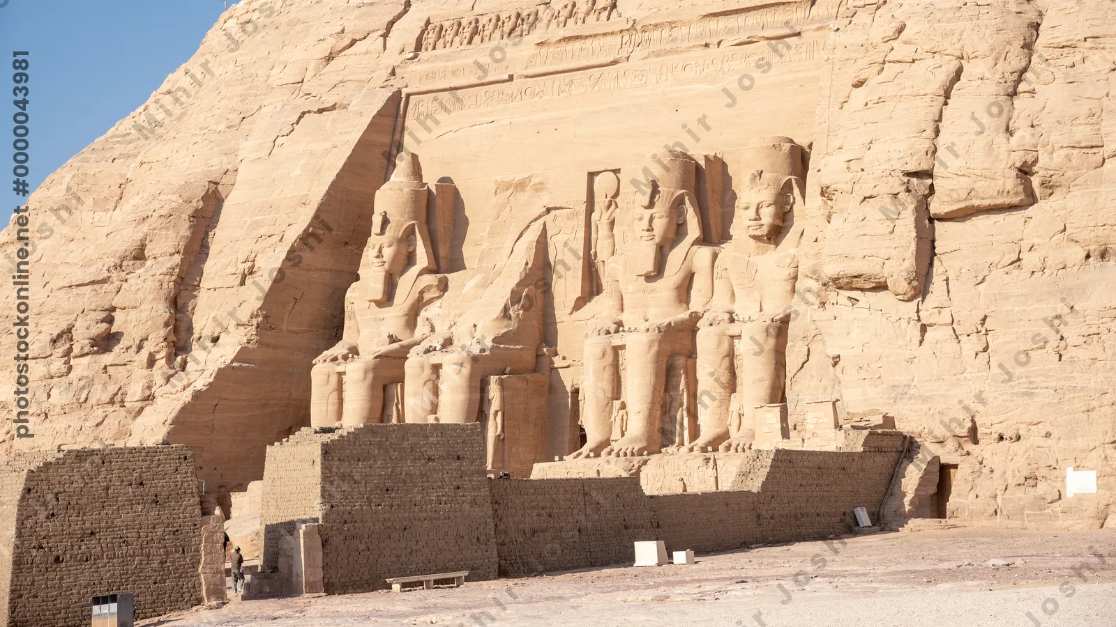Abu Simbel, Egypt - Feb 8, 2025:  Temple of Ramesses II at Abu Simbel, Egypt, with colossal rock statues at the entranc