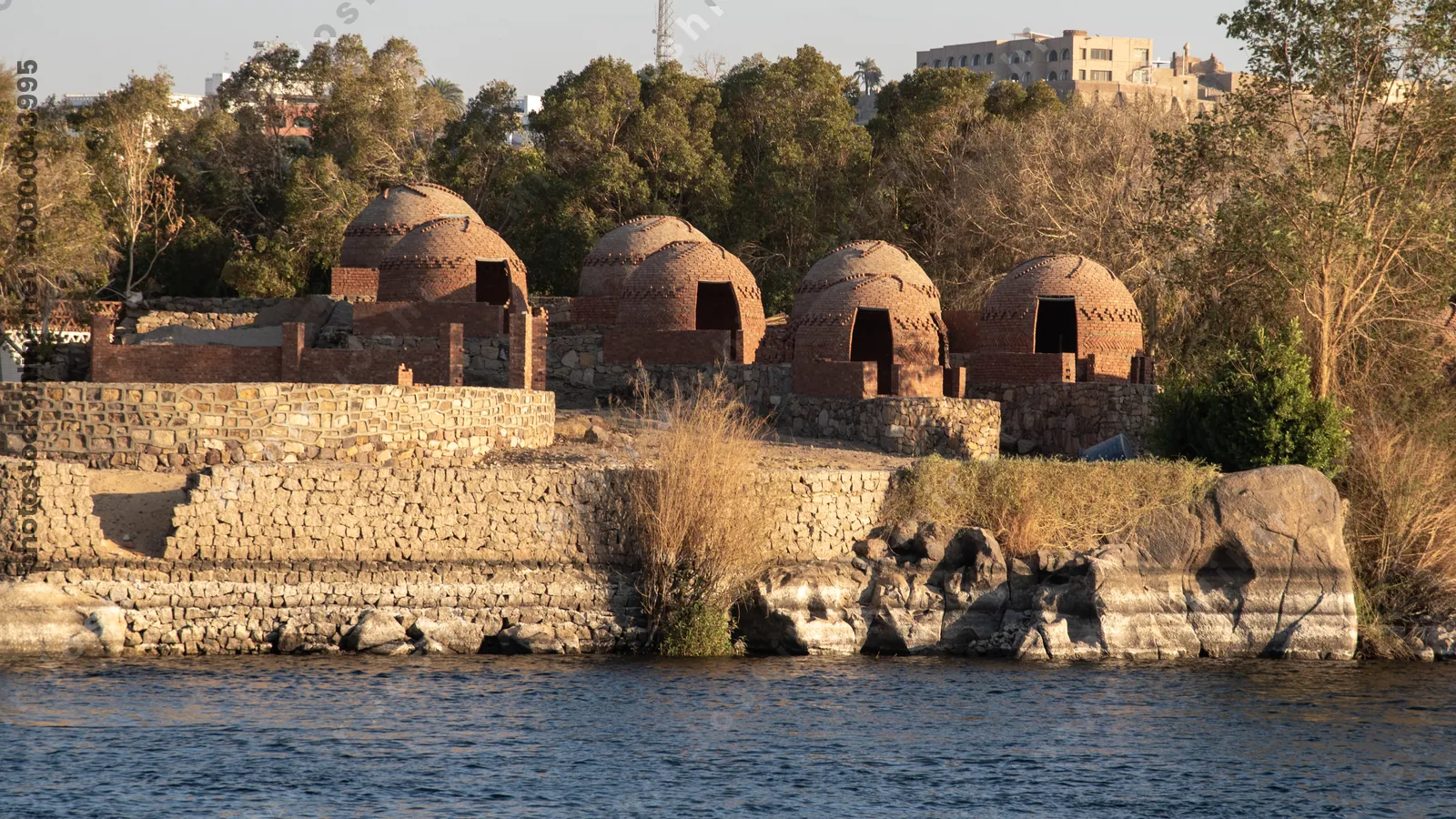 Aswan, Egypt - Feb 7, 2025:  Traditional Nubian houses on the Nile River bank near Aswan, Egypt