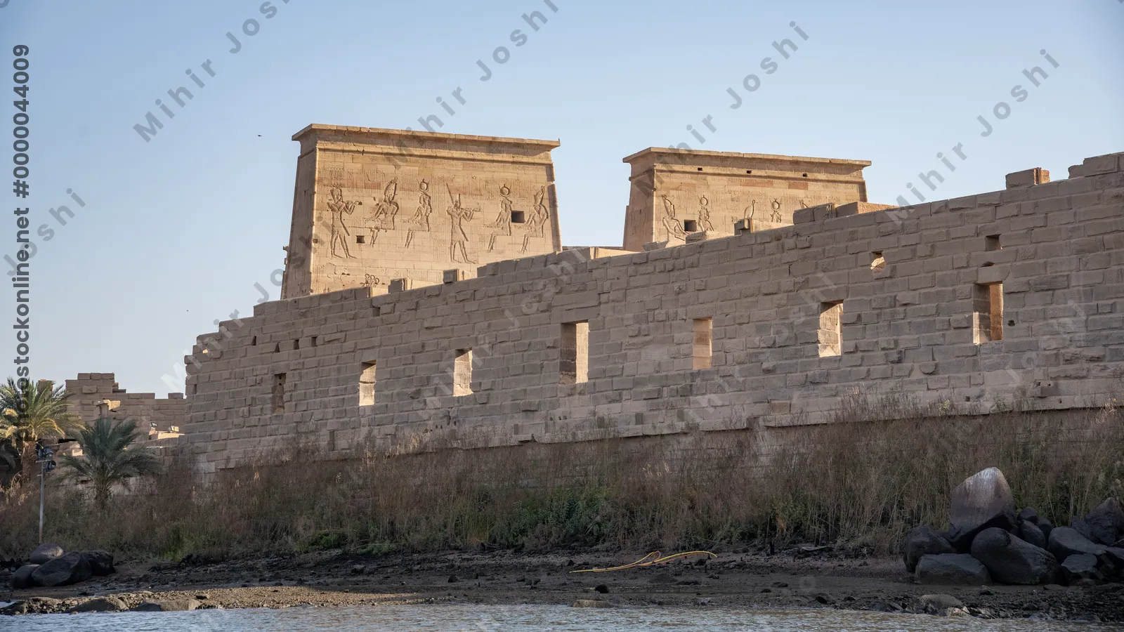 Aswan, Egypt - Feb 7, 2025:  Ancient Philae Temple complex on Agilkia Island by the Nile River in Aswan, Egypt.