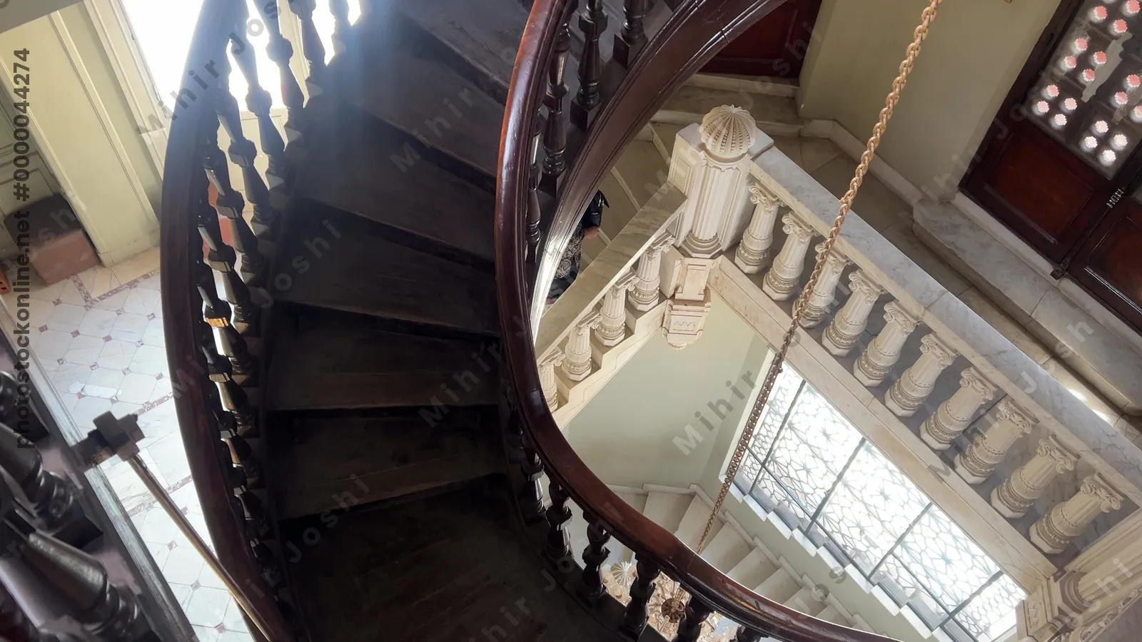 Heliopolis, Cairo, Egypt - Feb 4, 2024: Footage of an elaborate spiral stairway inside the historic Baron Empain Palace in Cairo, showcasing Indo-European architecture and design.