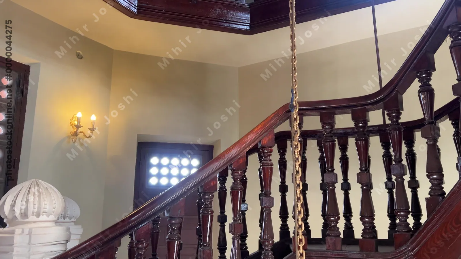 Heliopolis, Cairo, Egypt - Feb 4, 2024: Footage of an elaborate spiral stairway inside the historic Baron Empain Palace in Cairo, showcasing Indo-European architecture and design.