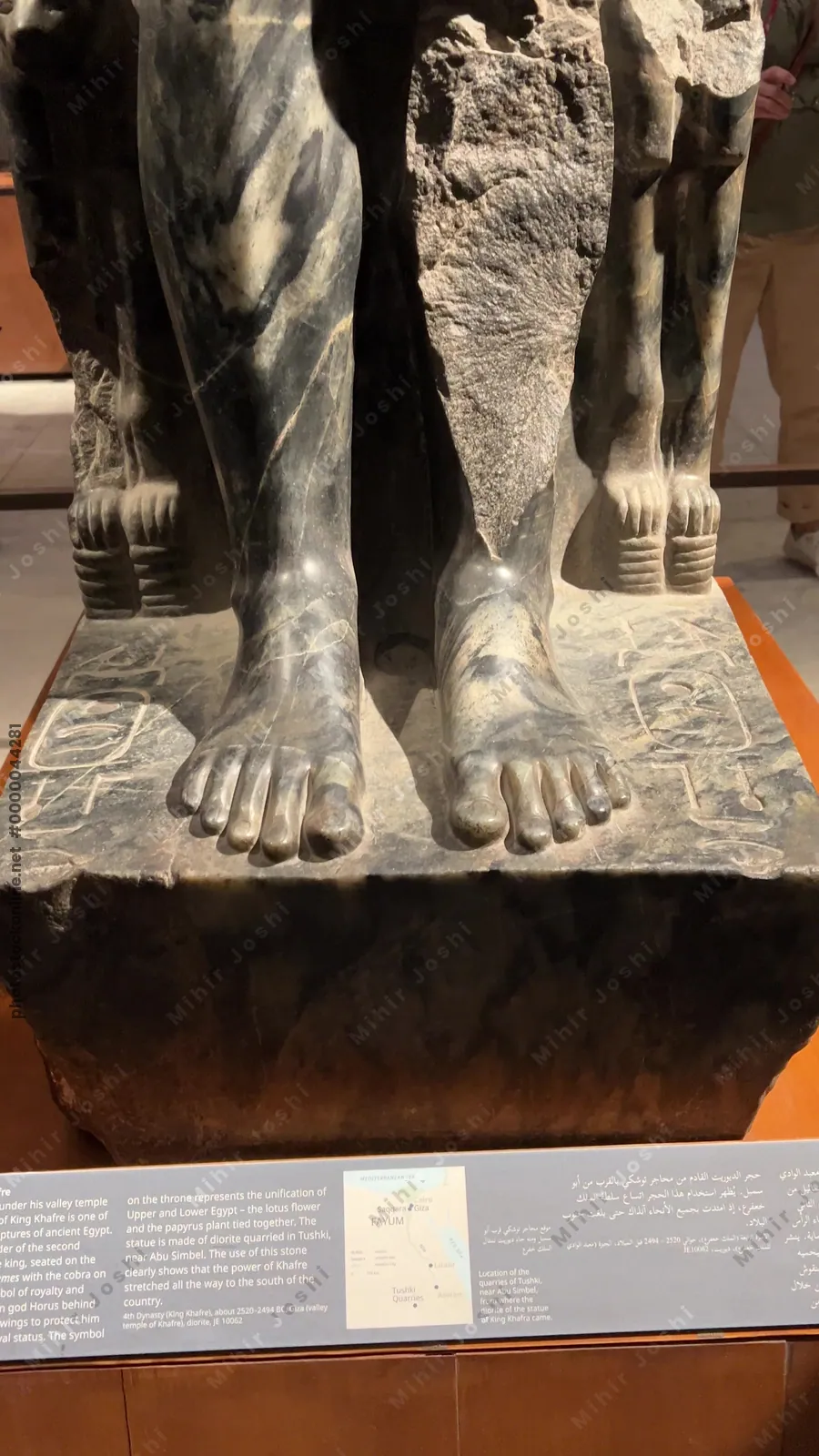 Cairo, Egypt - Feb 4, 2024: Seated diorite statue of Pharaoh Khafre, builder of the second pyramid of Giza, displayed at the Egyptian Museum in Cairo. A masterpiece of Old Kingdom sculpture.