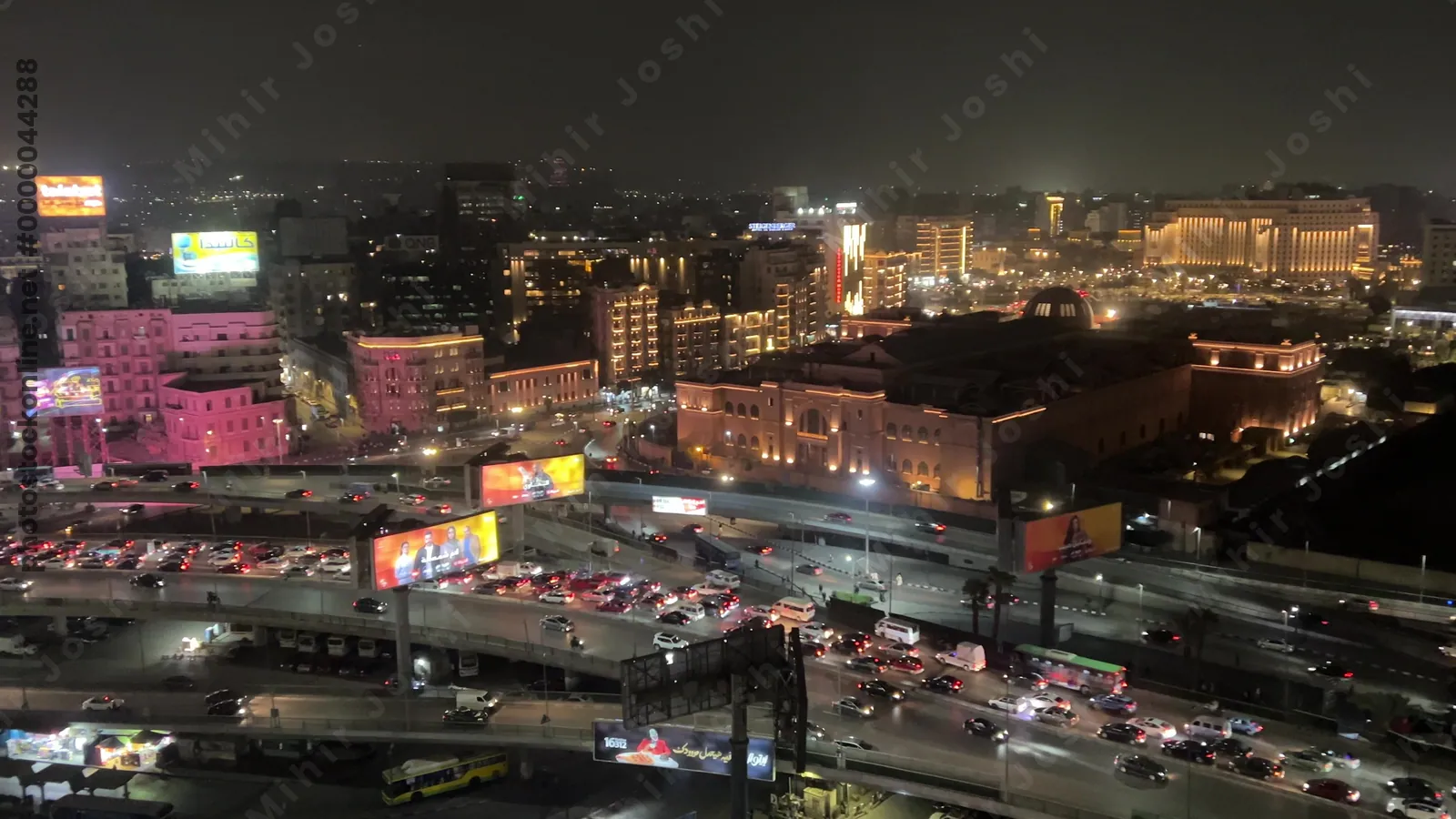 Cairo, Egypt - Feb 4, 2024: Nighttime aerial footage of Cairo, Egypt showing intense traffic, glowing streetlights, and the vibrant energy of the city after dark.