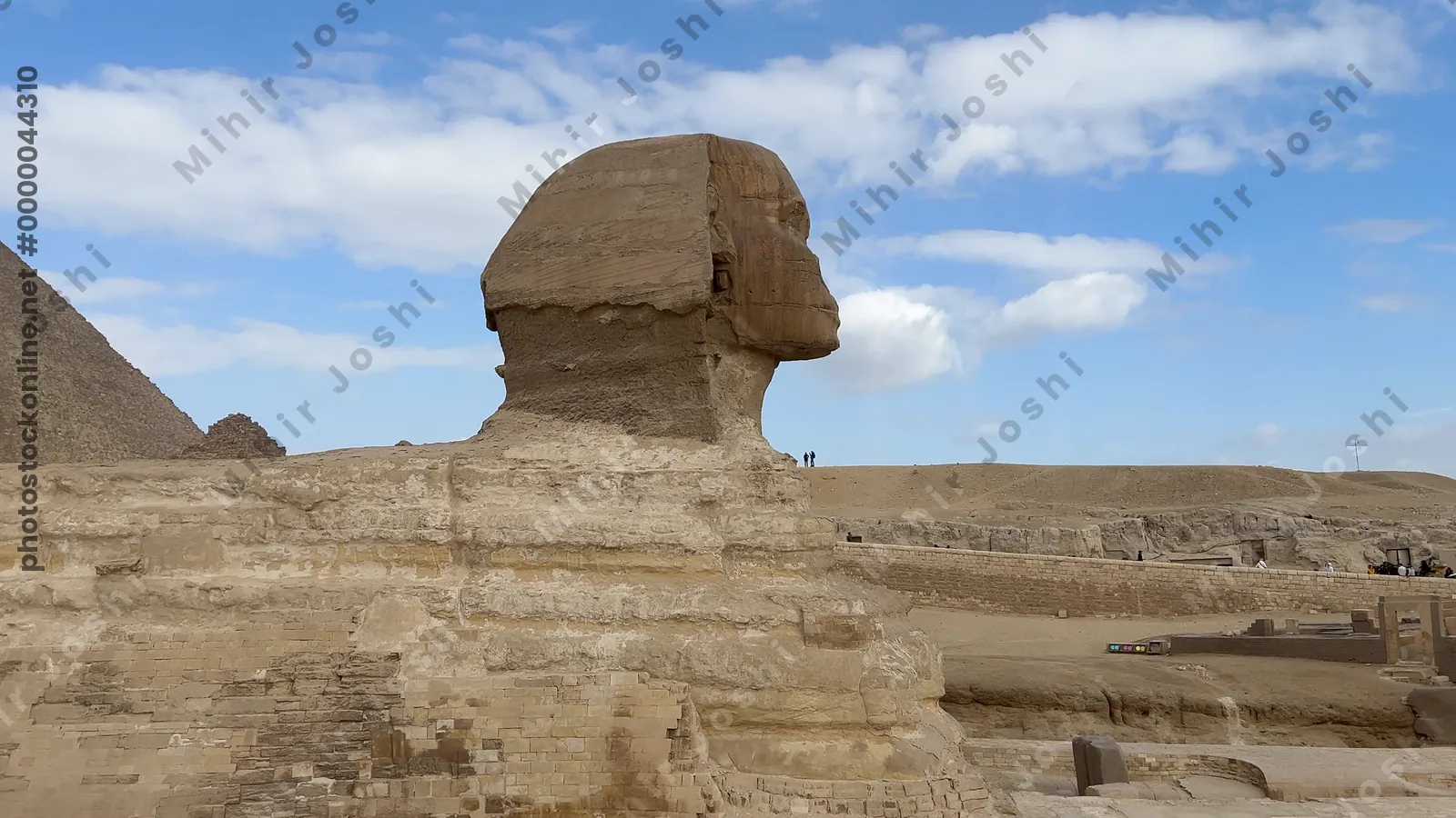 Giza, Egypt - Feb 5, 2025: Panoramic view of the Great Sphinx and Pyramids of Giza from the visitor pathway at the Giza Plateau, Egypt.