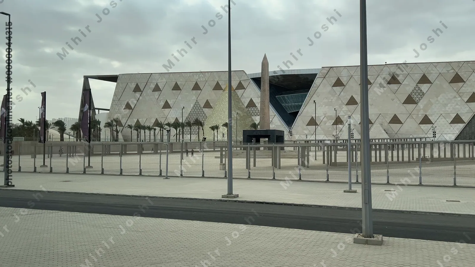 Giza, Egypt - Feb 6, 2025: View of the Grand Egyptian Museum from a moving bus near the Giza Pyramid complex in Cairo, Egypt.