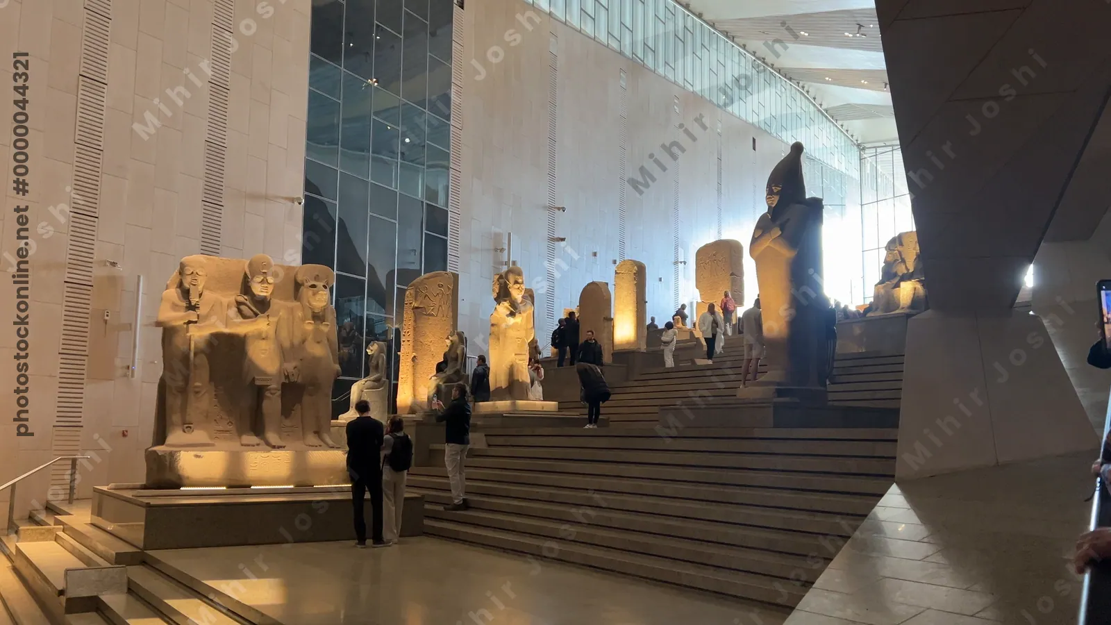 Giza, Egypt - Feb 6, 2025: View of the Grand Staircase at the Grand Egyptian Museum in Cairo, showcasing majestic pharaonic statues and vertical gallery design.