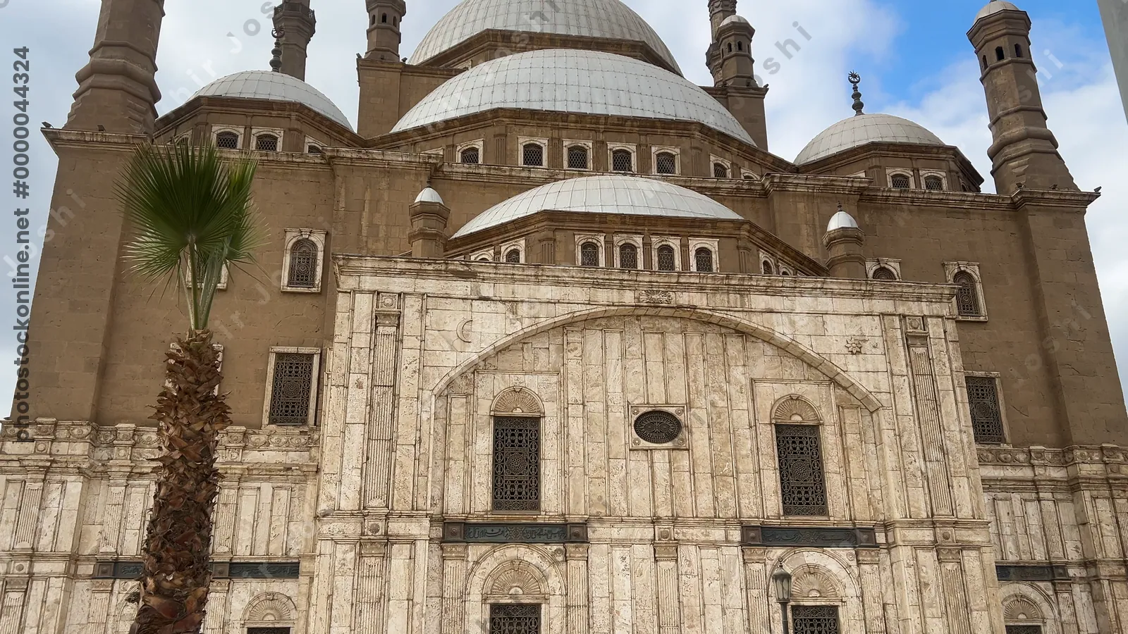 Cairo, Egypt - Feb 6, 2025:  Exterior view of the Muhammad Ali Mosque at the Citadel of Cairo, a famous Ottoman-era landmark and top tourist attraction in Egypt.