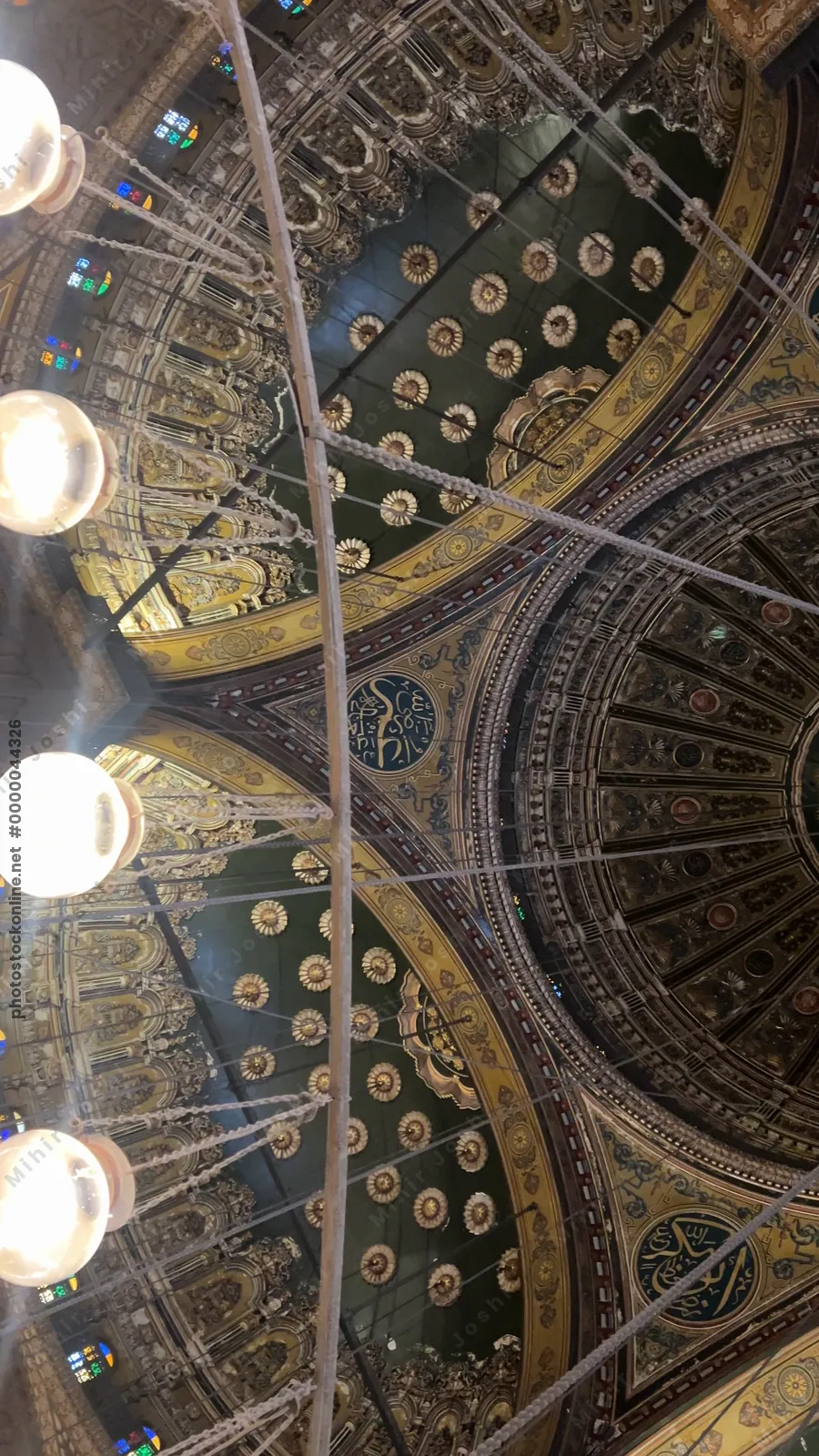 Cairo, Egypt - Feb 6, 2025: Illuminated interior of the Muhammad Ali Mosque with ornate domes and intricate Islamic designs in Cairo’s historic citadel.