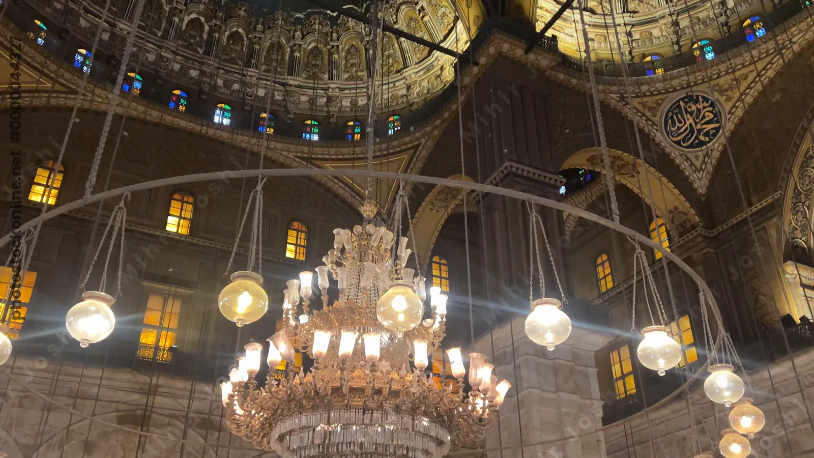 Cairo, Egypt - Feb 6, 2025: Illuminated interior of the Muhammad Ali Mosque with ornate domes and intricate Islamic designs in Cairo’s historic citadel.