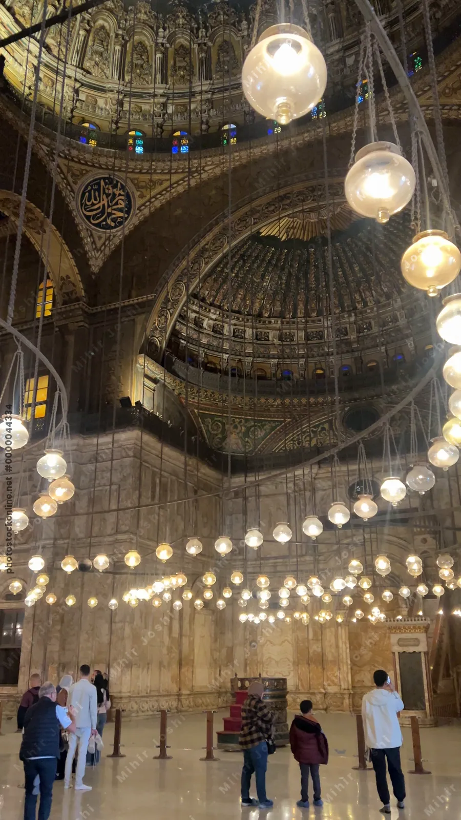 Cairo, Egypt - Feb 6, 2025: Illuminated interior of the Muhammad Ali Mosque with ornate domes and intricate Islamic designs in Cairo’s historic citadel.