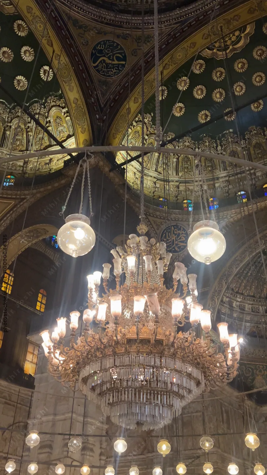 Cairo, Egypt - Feb 6, 2025: Illuminated interior of the Muhammad Ali Mosque with ornate domes and intricate Islamic designs in Cairo’s historic citadel.