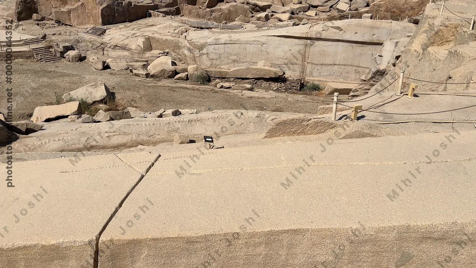 Aswan, Egypt - Feb 7, 2024: The Unfinished Obelisk in Aswan, Egypt, an ancient monument carved in granite quarries, showcasing pharaonic engineering and history.