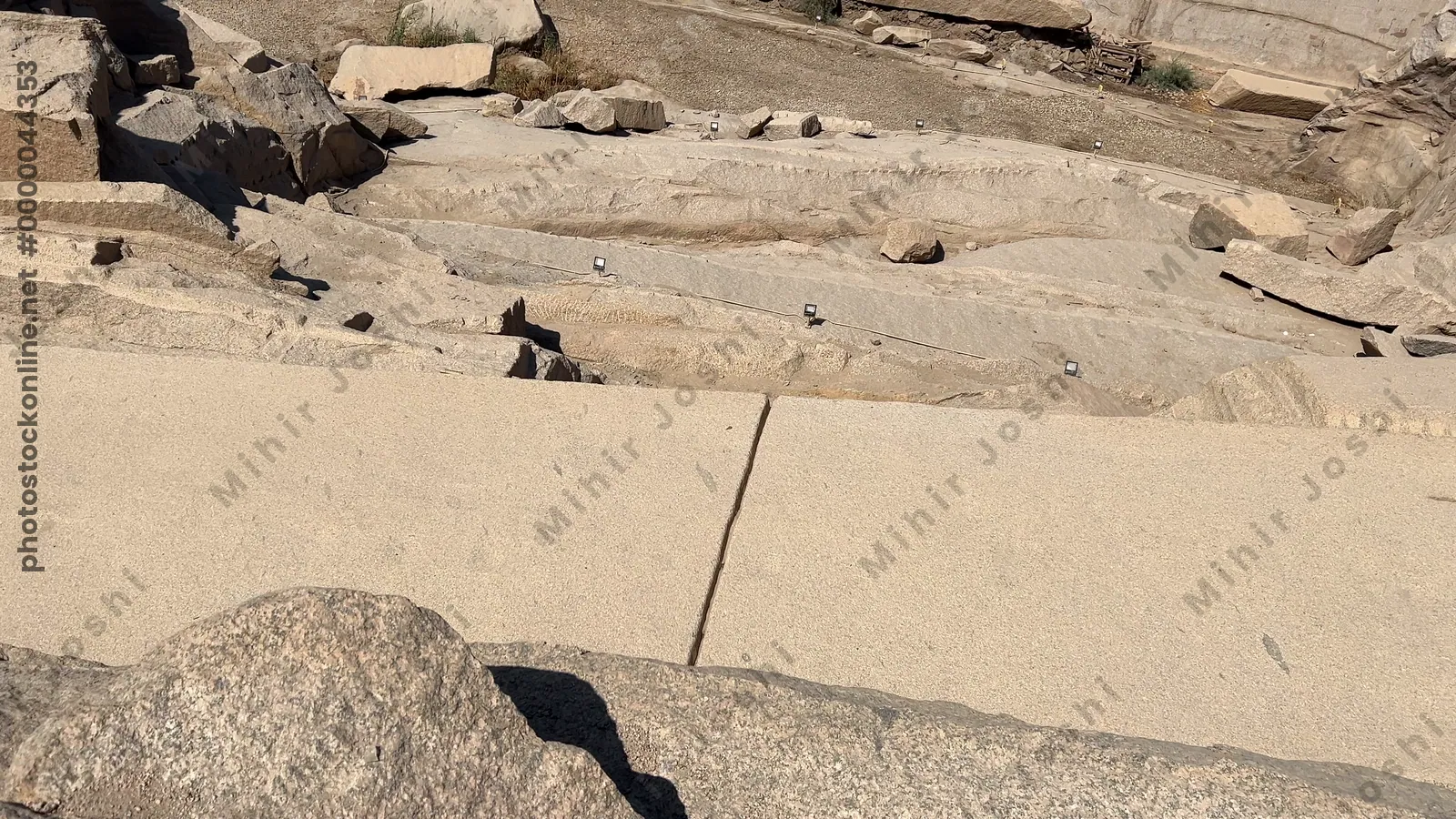 Aswan, Egypt - Feb 7, 2024: The Unfinished Obelisk in Aswan, Egypt, an ancient monument carved in granite quarries, showcasing pharaonic engineering and history.