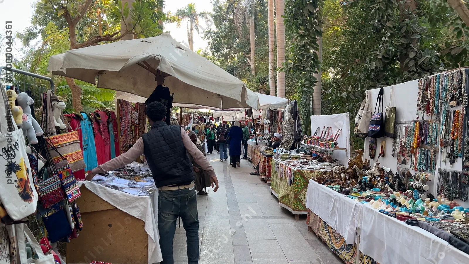 Kitchener's Island, Egypt - Feb 7, 2024: Visitors walking through souvenir shops inside the scenic botanical garden on Kitchener’s Island in Aswan, Egypt.